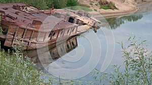 GOMEL, BELARUS old rusty metal river barge on the bay