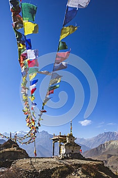 Gompa and Multicolored Buddhist flags in Muktinatn, Nepal