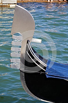 Gondola boat metallic bow in Grand Canal in Venice, Italy