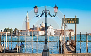 Gondola on Canal Grande with San Giorgio Maggiore church in Venice, Italy