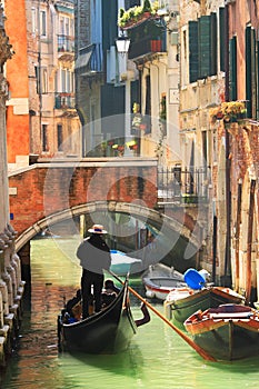 Gondola on canal in Venice, Italy.