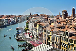 Gondola cruise on the canal in Venice, typical architecture of Italy