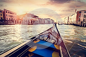 Gondola cruise on Grand Canal in Venice, Italy at sunset
