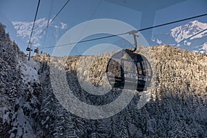 Gondola goes from the terminal in Grindelwald to Mannlichen. Ski lift in Switzerland Jungfrauregion