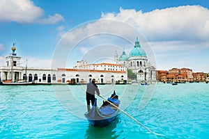 Gondola and gondolier in central Venice