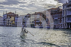 Gondola and gondolier on the Grand Canal, Venice photo