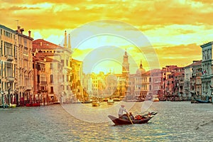 Gondola with gondolier near Rialto Bridge Grand Canal in Venice, Italy during sunset. Venice postcard. Tourism concept.