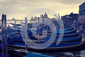 Gondola in grand canal at sunset, in venice italy
