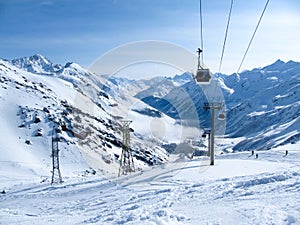 Gondola lift in the ski resort in the early morning at dawn