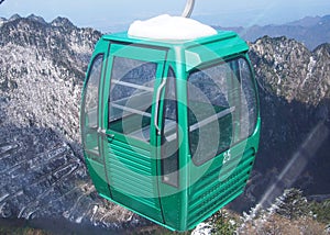Gondola lift on snowy mountain