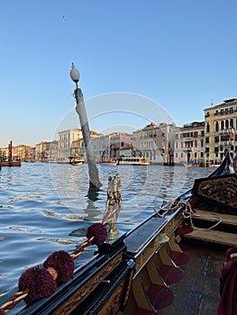 Gondola ride in Venice in a golden hour light