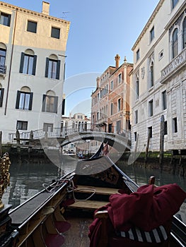 Gondola ride in Venice in a golden hour light