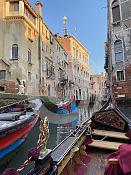 Gondola ride in Venice in a golden hour light