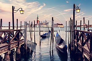 Gondola ride in Venice, Italy at sunset.