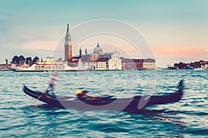 Gondola ride in Venice, Italy at sunset.