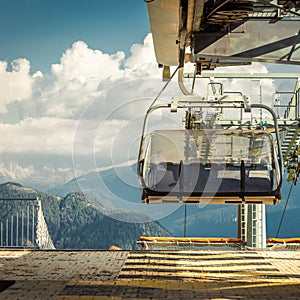 gondola ski lift in mountain ski resort, green forest