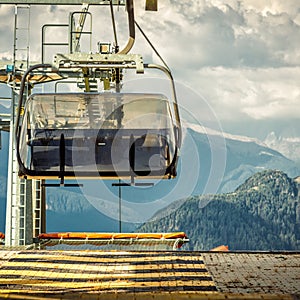 gondola ski lift in mountain ski resort, green forest