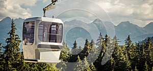 gondola ski lift in mountain ski resort, green forest