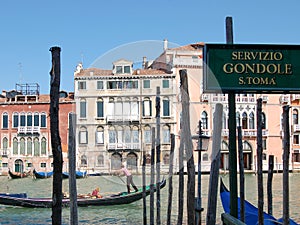 Gondola tour: canal, boats and old brick houses in Venice, Italy, Europe