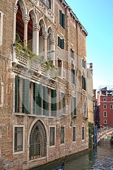 Gondola tour: canal,palaces, boats and old brick houses in Venice, Italy, Europe