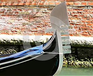 Gondola the typical Venetian boat and the background of bricks