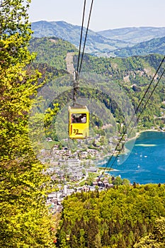 Gondola of Zwoelferhorn Seilbahn cable way and a view of alpin