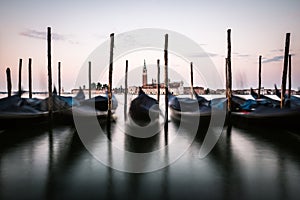 Gondolas with church of San Giorgio Maggiore in Venice, Italy