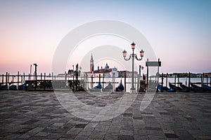 Gondolas with church of San Giorgio Maggiore in Venice, Italy on the island