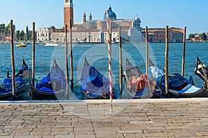 Gondolas docked in the harbour in Venice