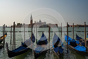 Gondolas docked on the venetian lagoon