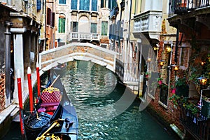 Gondolas and illuminated street lamps, Venice, Italy
