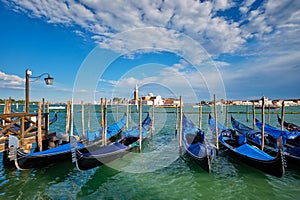 Gondolas and in lagoon of Venice by San Marco square. Venice, Italy