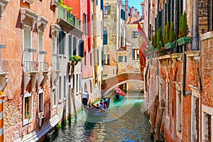 Gondolas on lateral narrow Canal in Venice, Italy