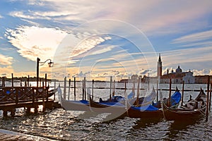 Gondolas moored on the Grand Canal in Venice, evening
