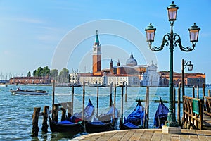 Gondolas moored near San Marco square across from San Giorgio Maggiore island in Venice, Italy