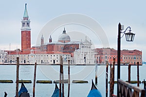 Gondolas moored by Saint Mark square with San Giorgio di Maggiore church on the background