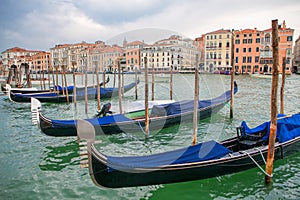 Gondolas moored to the wooden pier