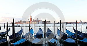 Gondolas movements and canal in Venice, nobody in the morning, Italy