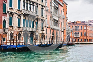Gondolas near houses in Venice in rain