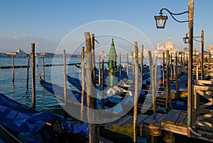 Gondolas at a pier in Venice, Italy