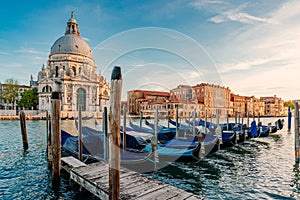 Gondolas and Santa Maria della Salute famous church, Venice, Italy