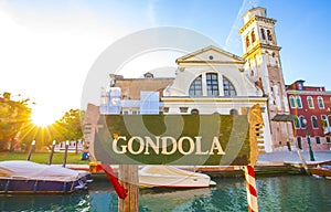 Gondolas station in Venice at sunset