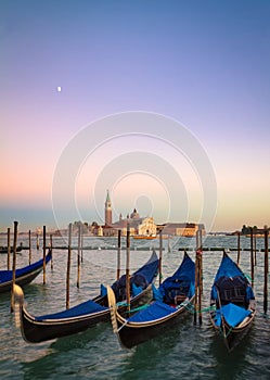 Gondolas at sunset with San Giorgio di Maggiore church, Venice, Venezia, Italy