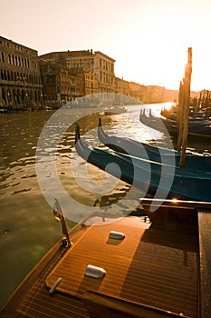 Gondolas at sunset in Venice photo