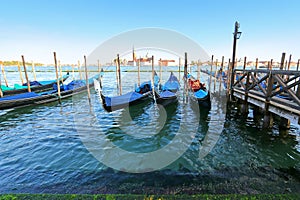 Gondolas at their moorings in the evening in Venice, Italy