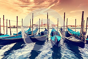 Gondolas in Venice, Italy at sunset