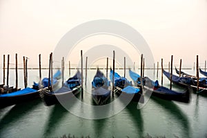 Gondolas in Venice during a misty/foggy spring day.