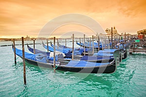 Gondolas with view of Santa Maria della Salute at sunset