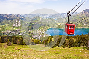 Gondolas of Zwoelferhorn Seilbahn cable way and a view of alpine landscape, Austria