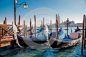 Gondolier carries tourists gondola Grand Canal of Venice, Italy.